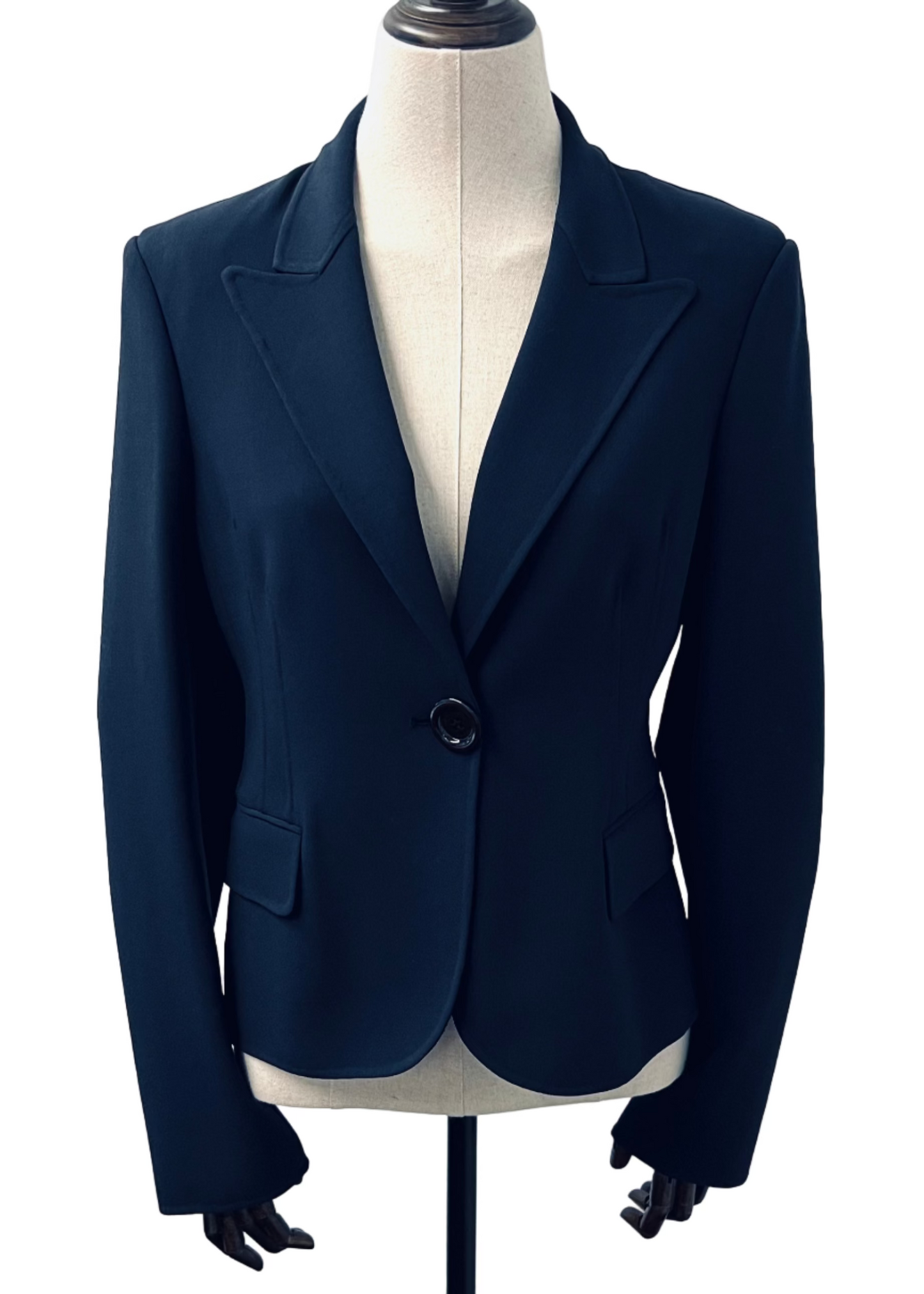 A navy blue Michael Kors blazer with a single button and two pockets, displayed on a mannequin against a white background.