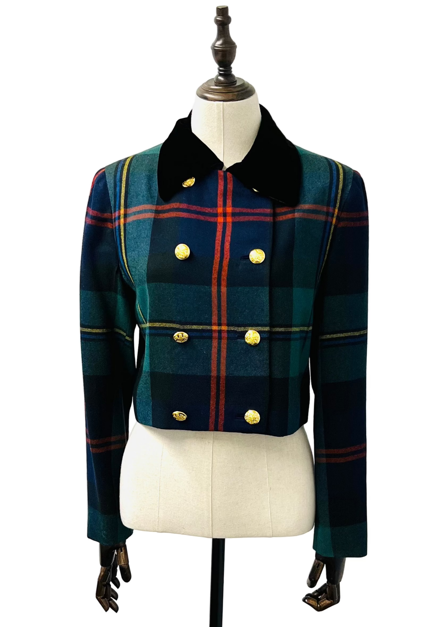 Plaid jacket with gold buttons on a mannequin against a white background