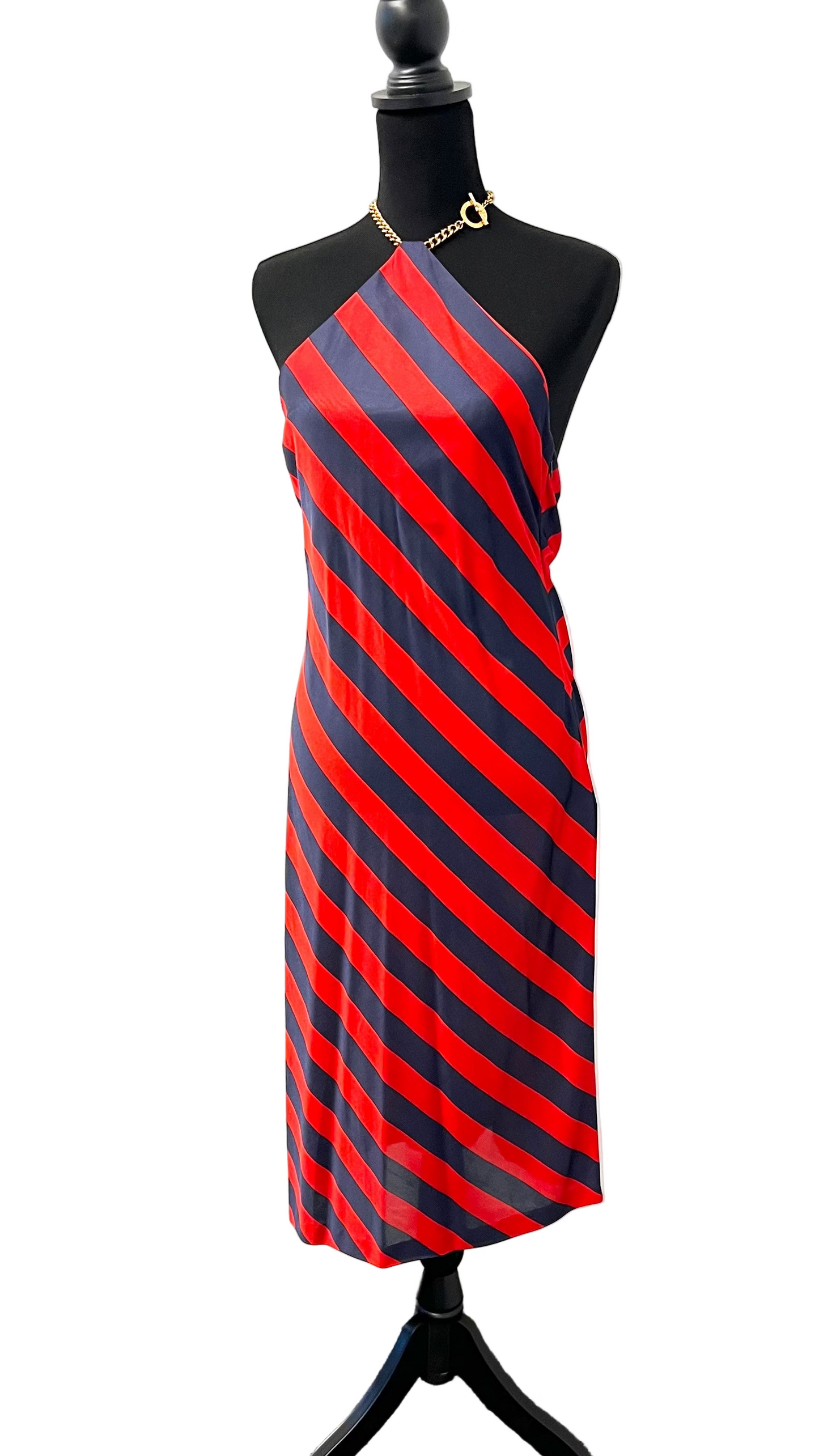Mannequin wearing a red and black striped dress on a white background