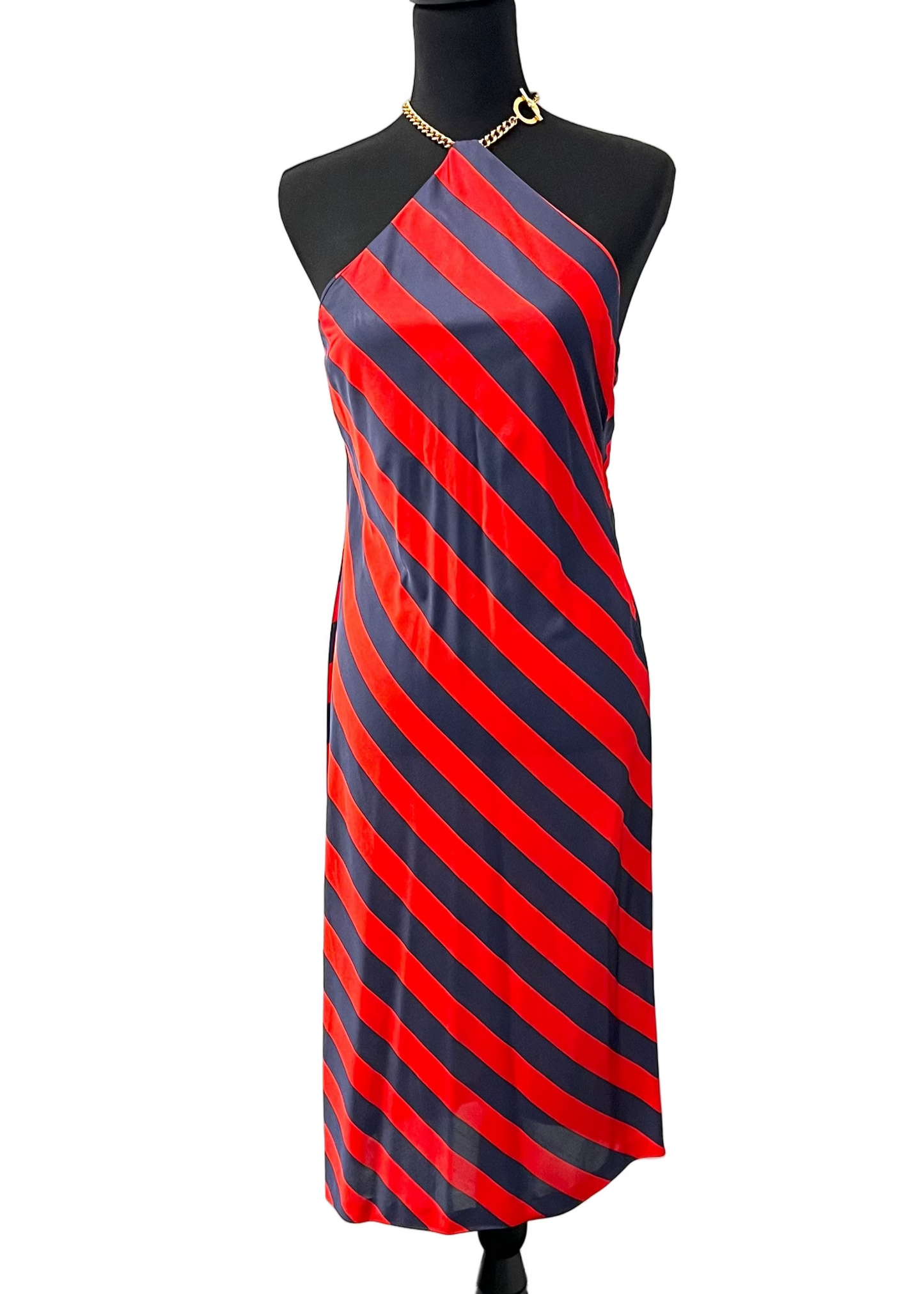 Mannequin wearing a red and black striped dress against a white background