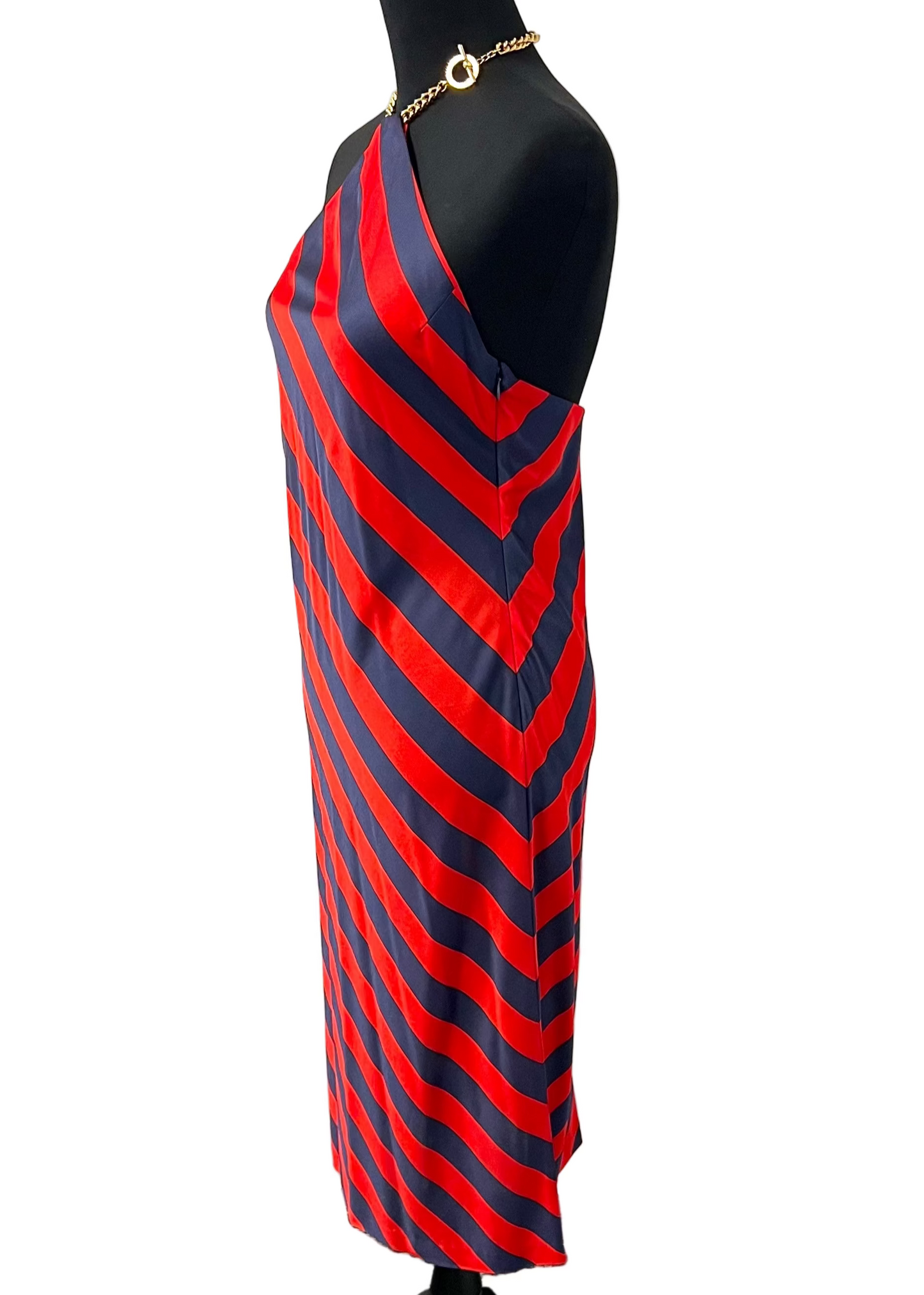 Red and blue striped dress on a mannequin against a white background