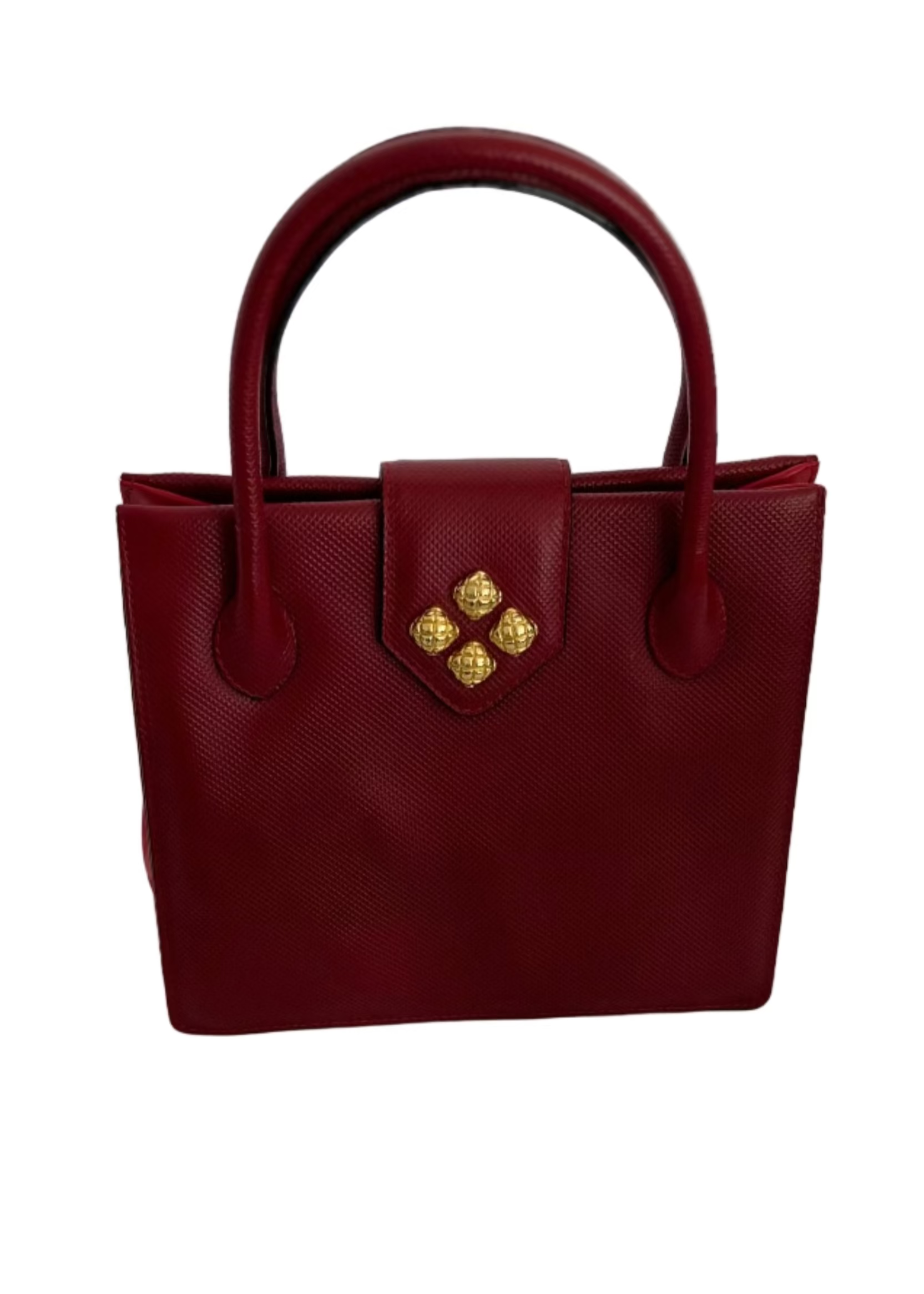 Red handbag with gold accents on a light gray surface